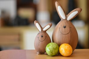 Charming Easter bunny figures with vibrant eggs capture the festive spirit of Easter indoors.
