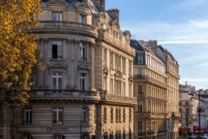Elegant historic buildings on Boulevard Saint-Germain in Paris during daylight.